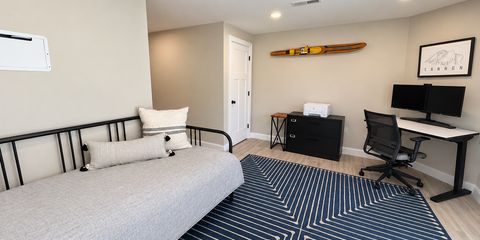 Bright, decluttered home office with daybed-21.png