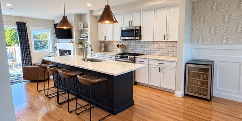 Bright, decluttered kitchen with warm lighting-19.png