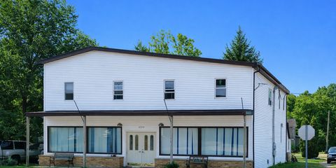 Rural building with green landscape.png