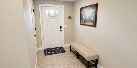 Bright decluttered entryway with bench-23.png