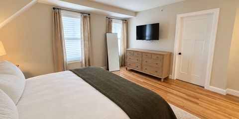 Brightened bedroom with tidy bedding-16.png