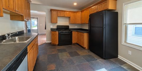Reverse-Angle Kitchen with Black Appliances.png